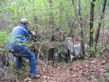 FST examines a culvert along the proposed rail trail